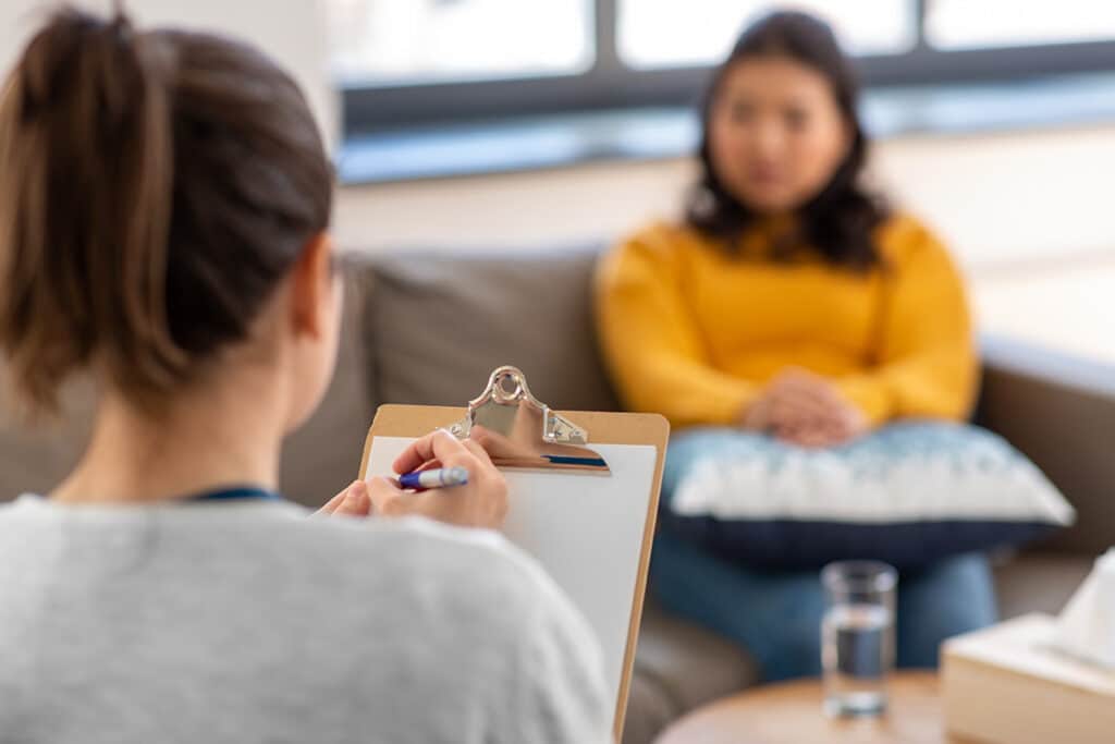 A woman asking, "What is psychiatric care?"